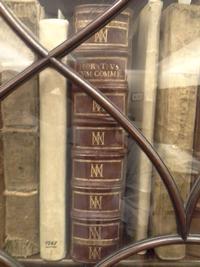 Horace. Opera book behind glass, wooden bookcase.